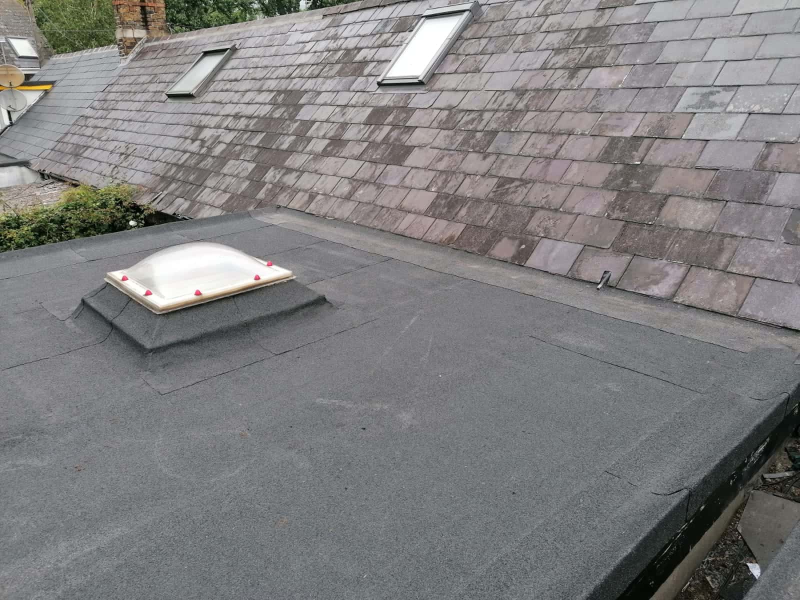 Torch-on felt being professionally applied to flat roof