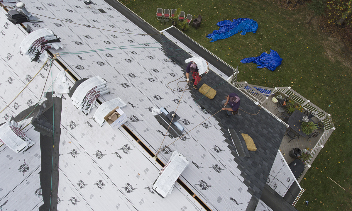 Roofing team working on a residential roof