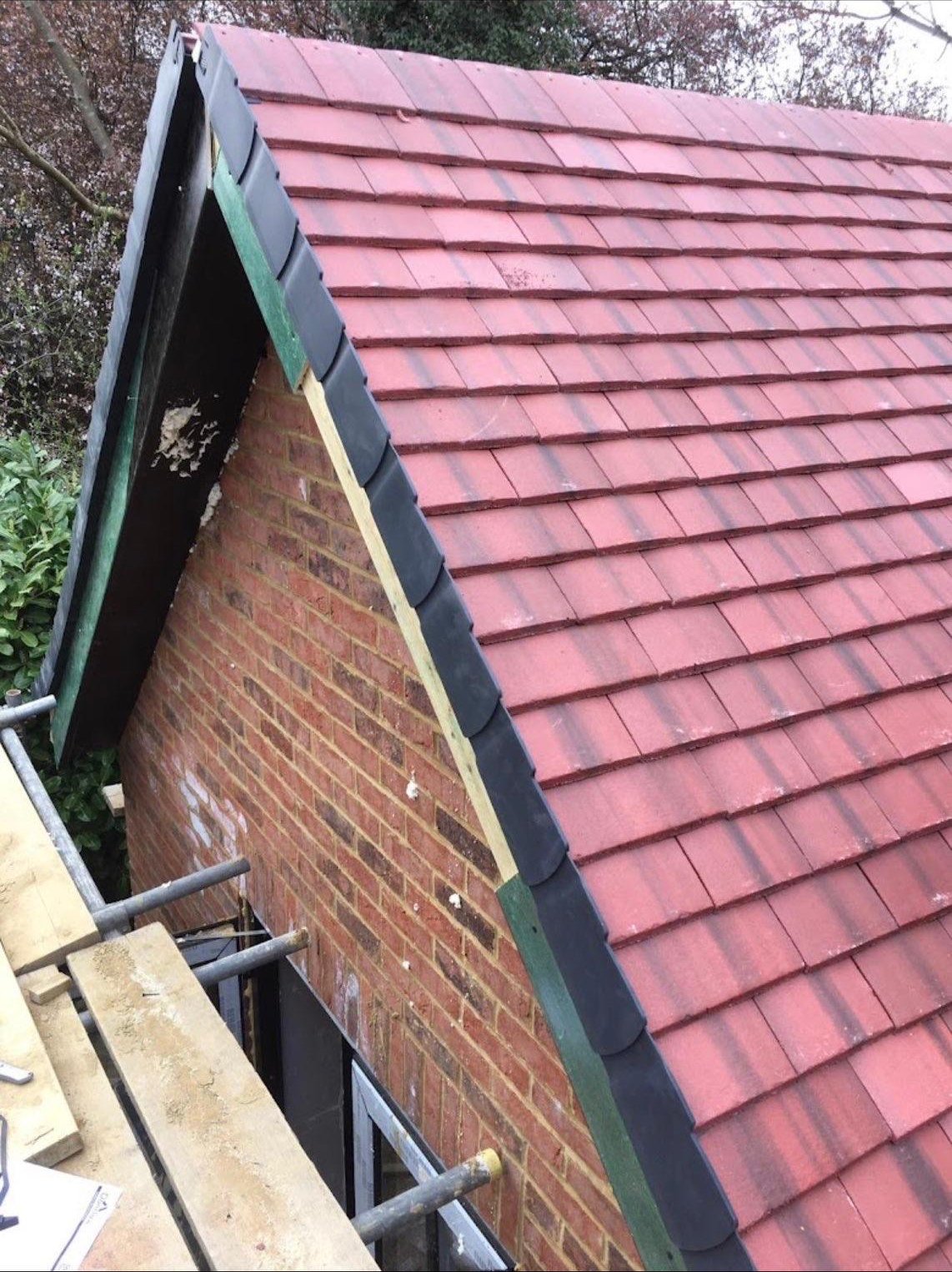 Finished slate roof with skylight and chimney detail